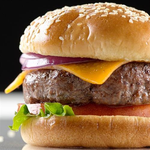 Two raw chuck, brisket and short rib burger patties