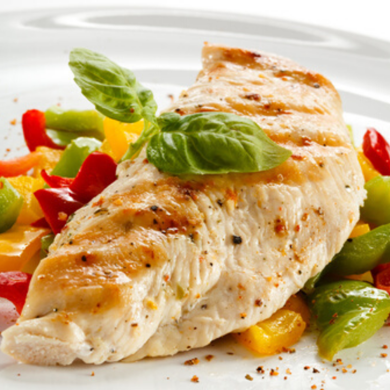 Raw boneless skinless chicken breasts, hand trimmed