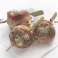 Bacon wrapped blue cheese meatballs on bamboo skewers