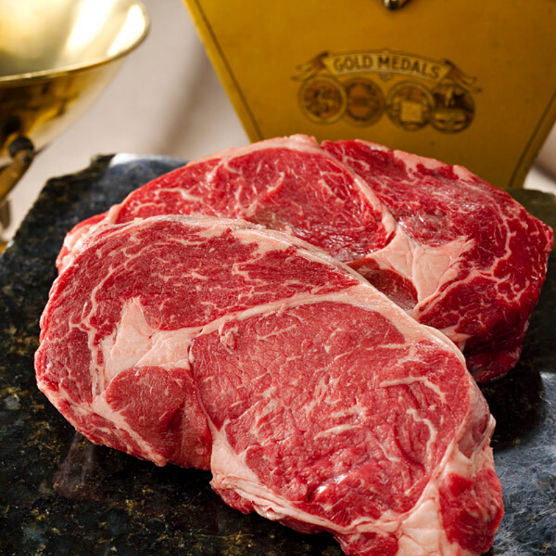 Raw drop cut rib eye steak showing heavy marbling