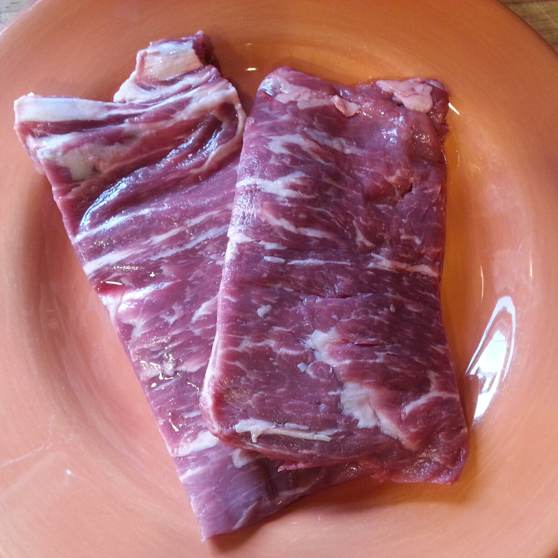 Raw spinalis ribeye cap steaks, vacuum sealed