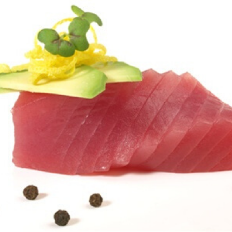 Sliced raw yellowfin saku tuna loin, sashimi grade