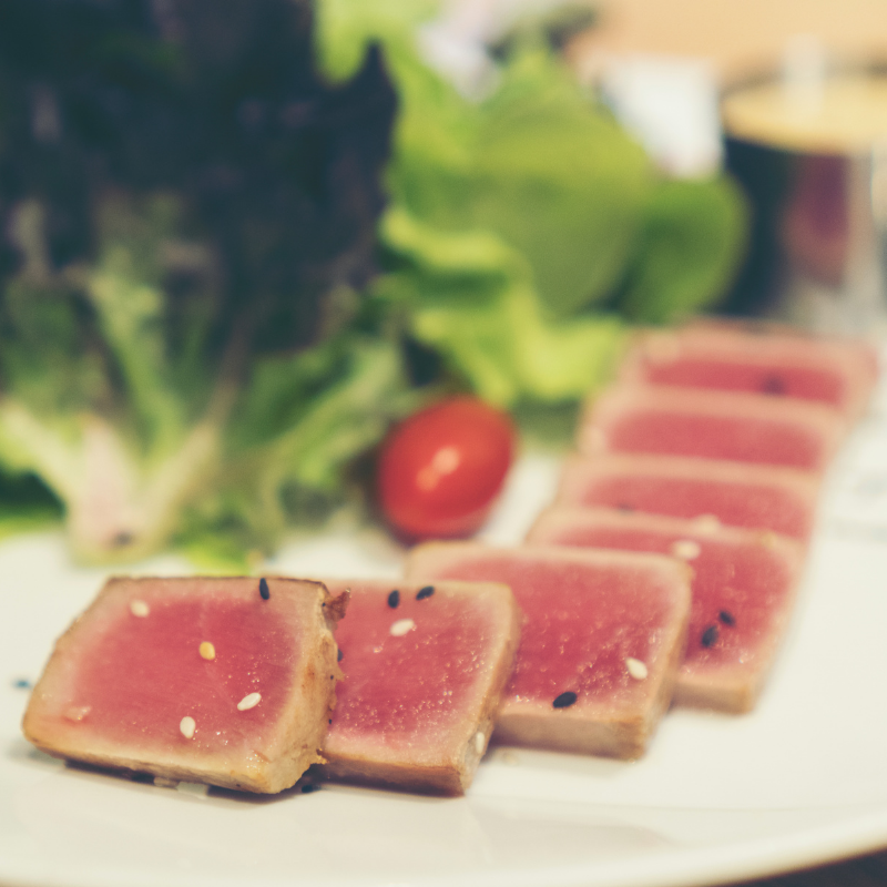 Pepper-crusted seared ahi tuna slices ready to serve